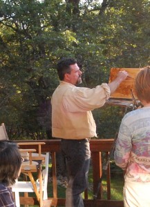 Image of artist Stefan Baumann doing a painting demonstration