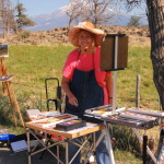 This is a photo of a participant oil painting on location at The Grand View Workshop as she sets up her equipment.