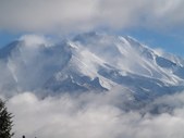 Photograph of Mount Shasta in Winter Snow with sun shining from an angle