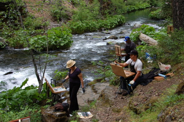 This is a photo of participants in The Grand View Workshop painting the Cabin Creek River in the Summer.