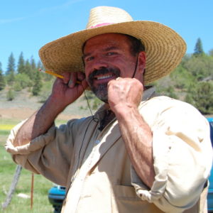 Plein Air Workshop Artist Stefan Baumann demonstrates how to protect yourself from the sun by wearing a big hat.