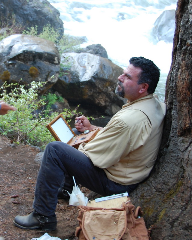 This is a photo of Stefan Baumann as he listens to participant's questions and offers helpful information about painting on location.