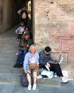 Stefan Baumann with his students in Siena, a city in central Italy’s Tuscany region, is distinguished by its medieval brick buildings.