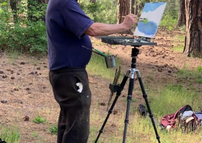 Workshop participant paints at The Grand View Ranch