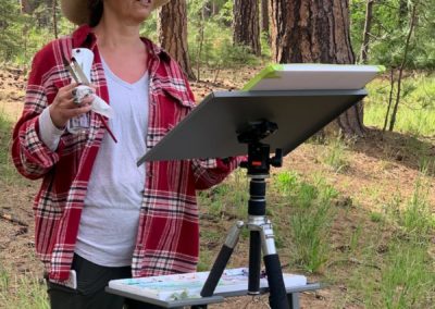 Workshop participant paints at The Grand View Ranch