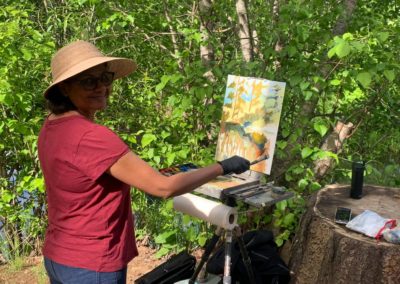 Workshop participant paints at The Grand View Ranch