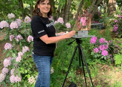 Workshop participant paints at The Grand View Ranch